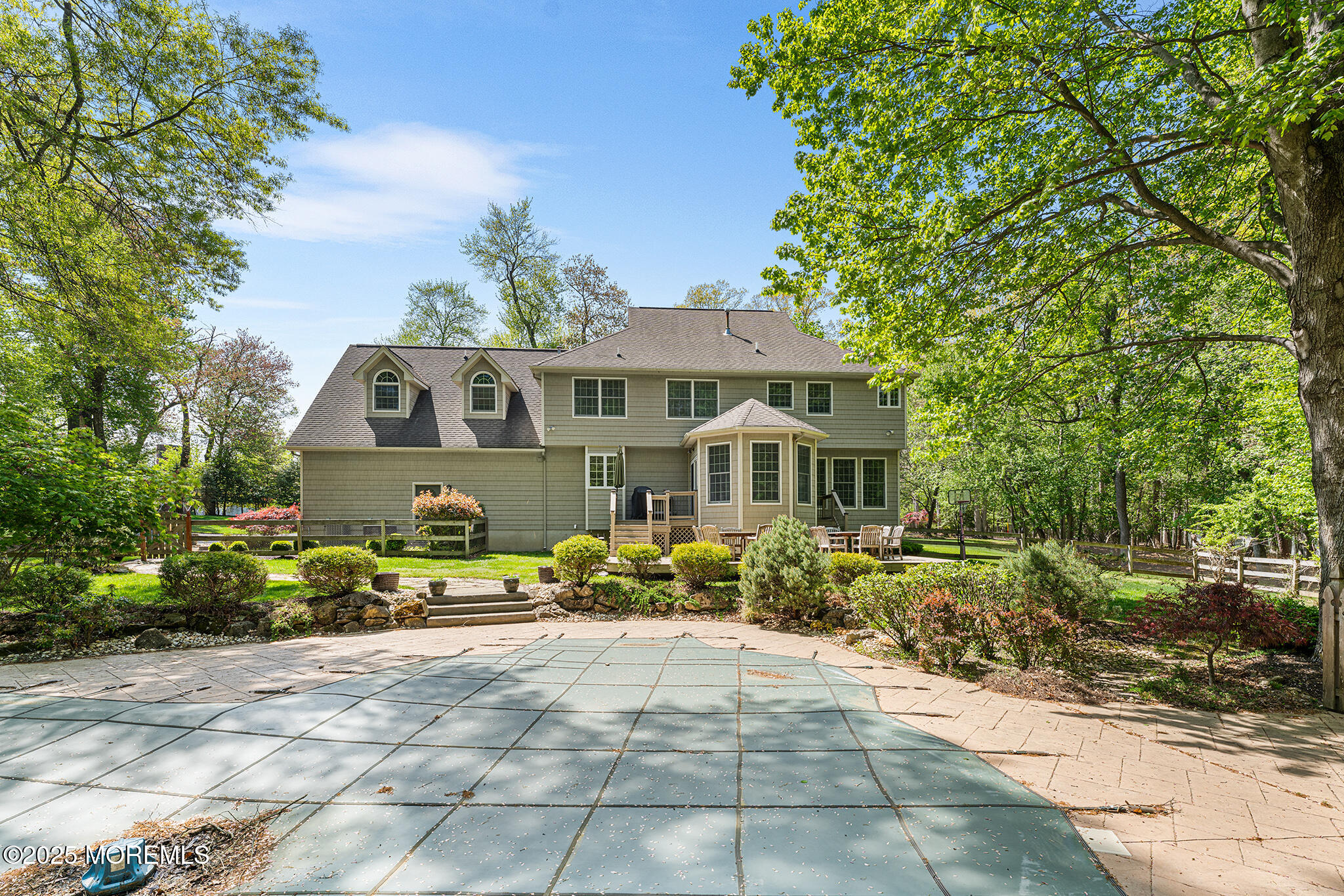 109 Merrick Road Farmingdale, NJ 07727 - Photo 50 of 62 a front view of a house with a yard and potted plants
