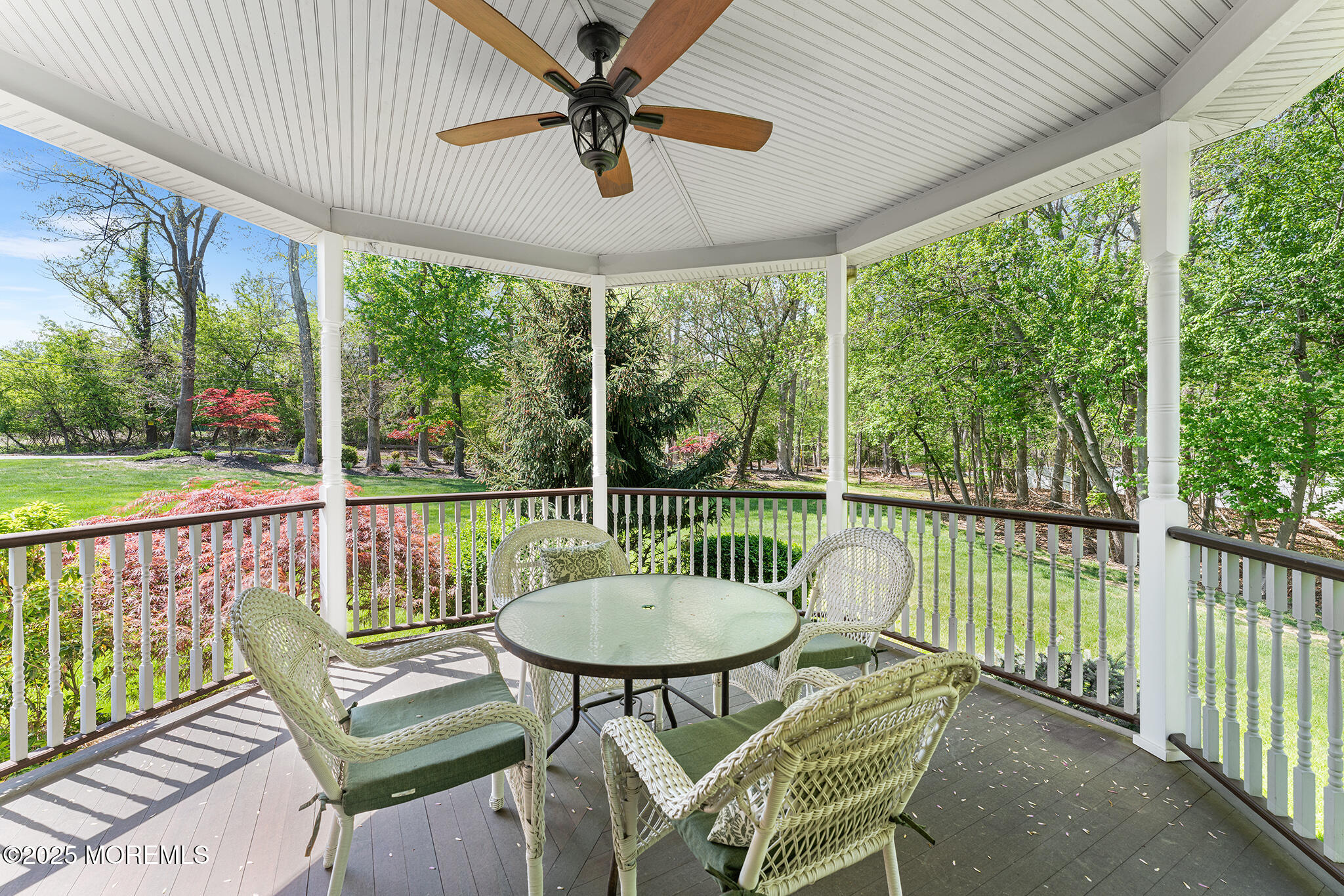 109 Merrick Road Farmingdale, NJ 07727 - Photo 5 of 62 a balcony with table and chairs
