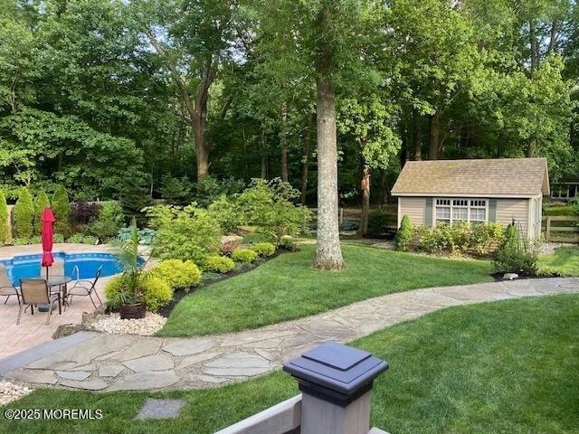 109 Merrick Road Farmingdale, NJ 07727 - Photo 55 of 62 a view of a house with backyard and a sitting area