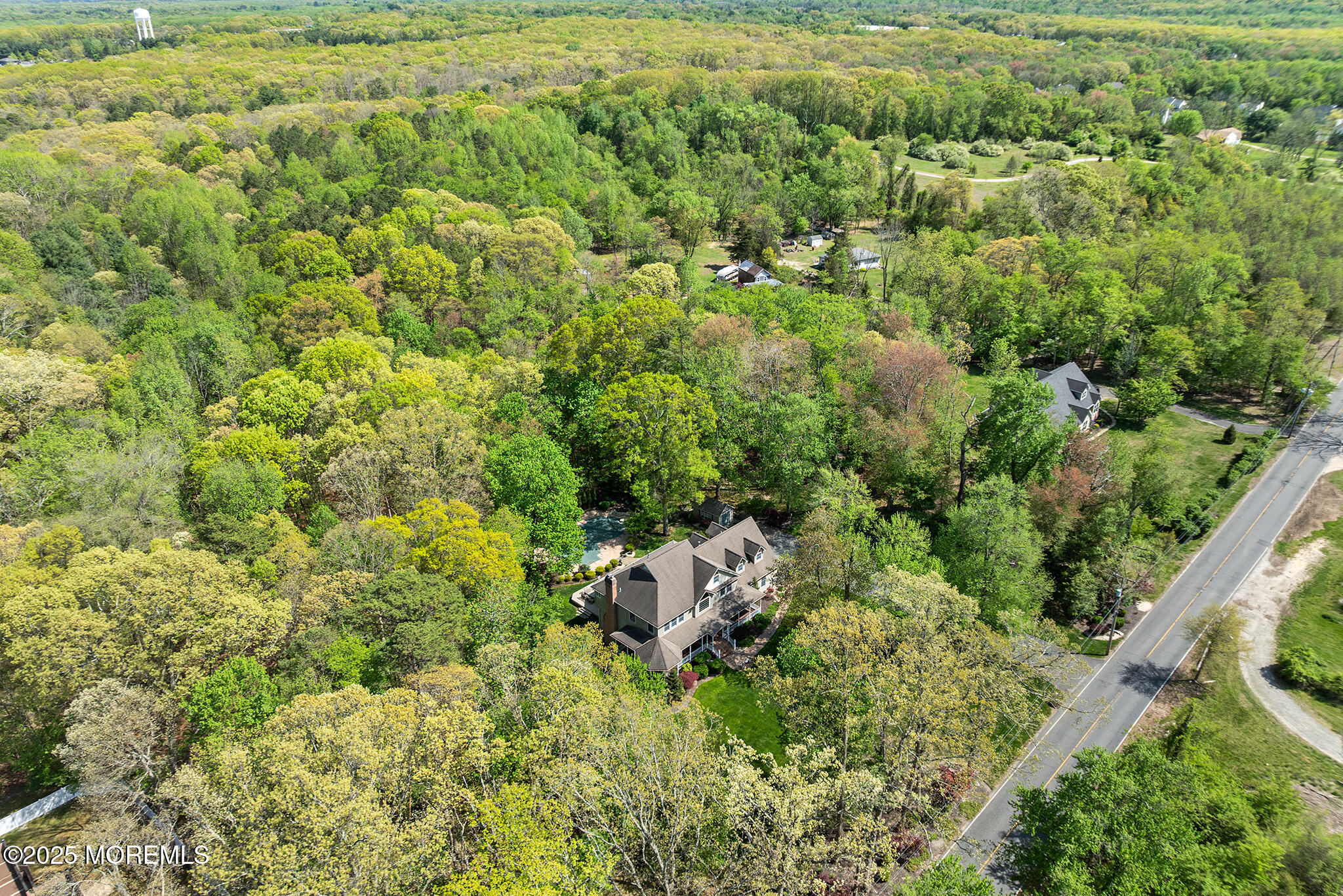 109 Merrick Road Farmingdale, NJ 07727 - Photo 59 of 62 a view of a garden with a building