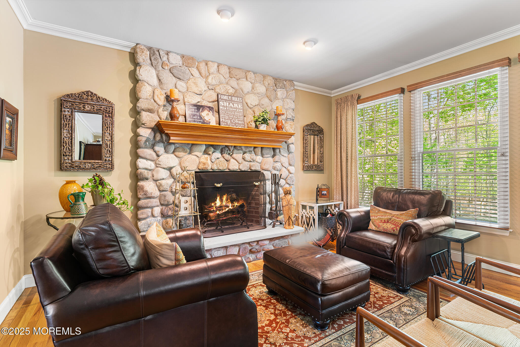 109 Merrick Road Farmingdale, NJ 07727 - Photo 10 of 62 a living room with furniture and a fireplace
