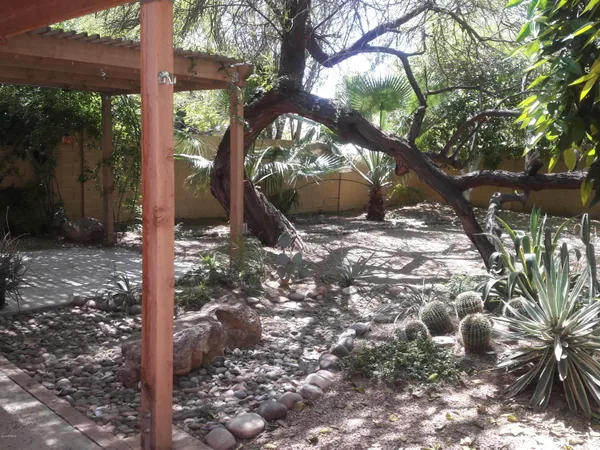 a backyard of a house with lots of green space