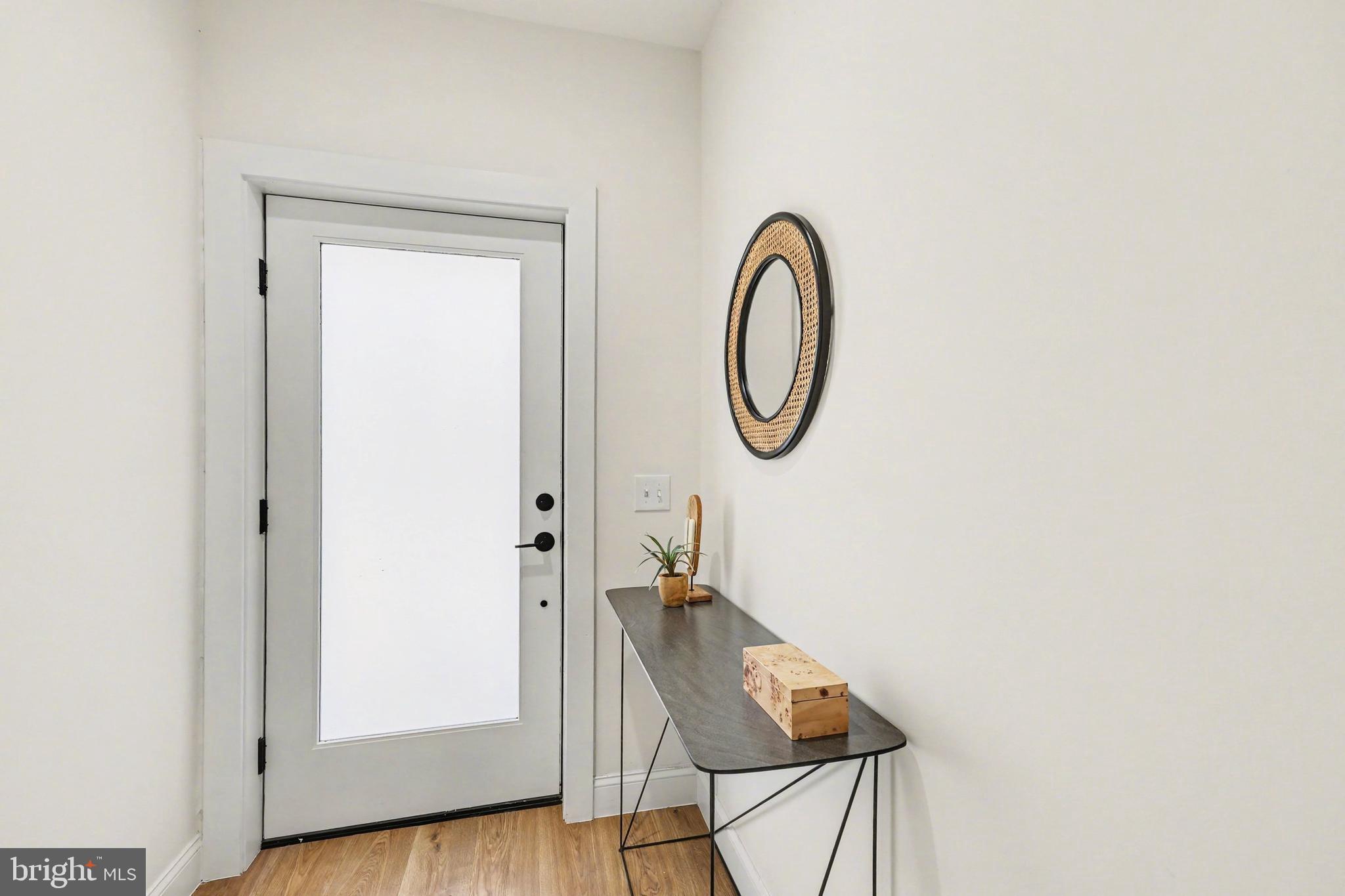 842 Madison Street Northwest, Unit 2 Washington, DC 20011 - Photo 2 of 27 a view of a room with wooden floor