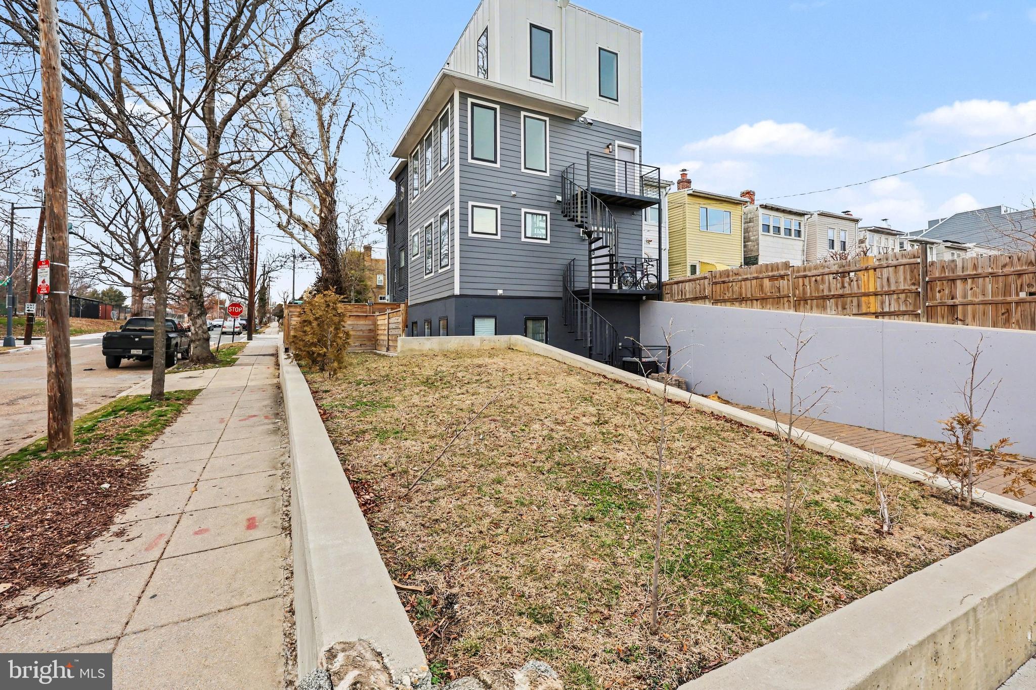 842 Madison Street Northwest, Unit 2 Washington, DC 20011 - Photo 21 of 27 a view of a backyard with large trees