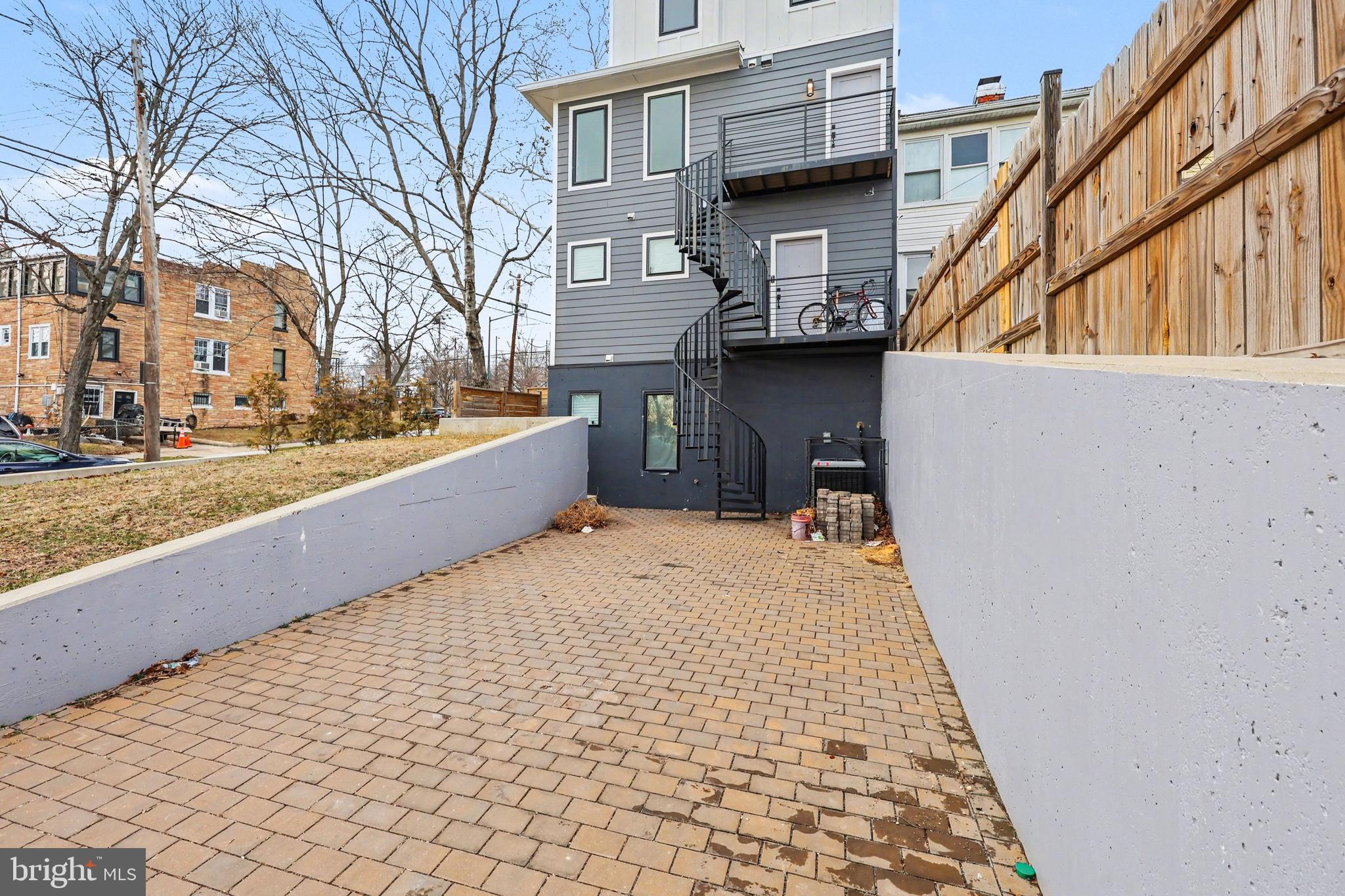 842 Madison Street Northwest, Unit 2 Washington, DC 20011 - Photo 22 of 27 a view of a house with a snow on the wall