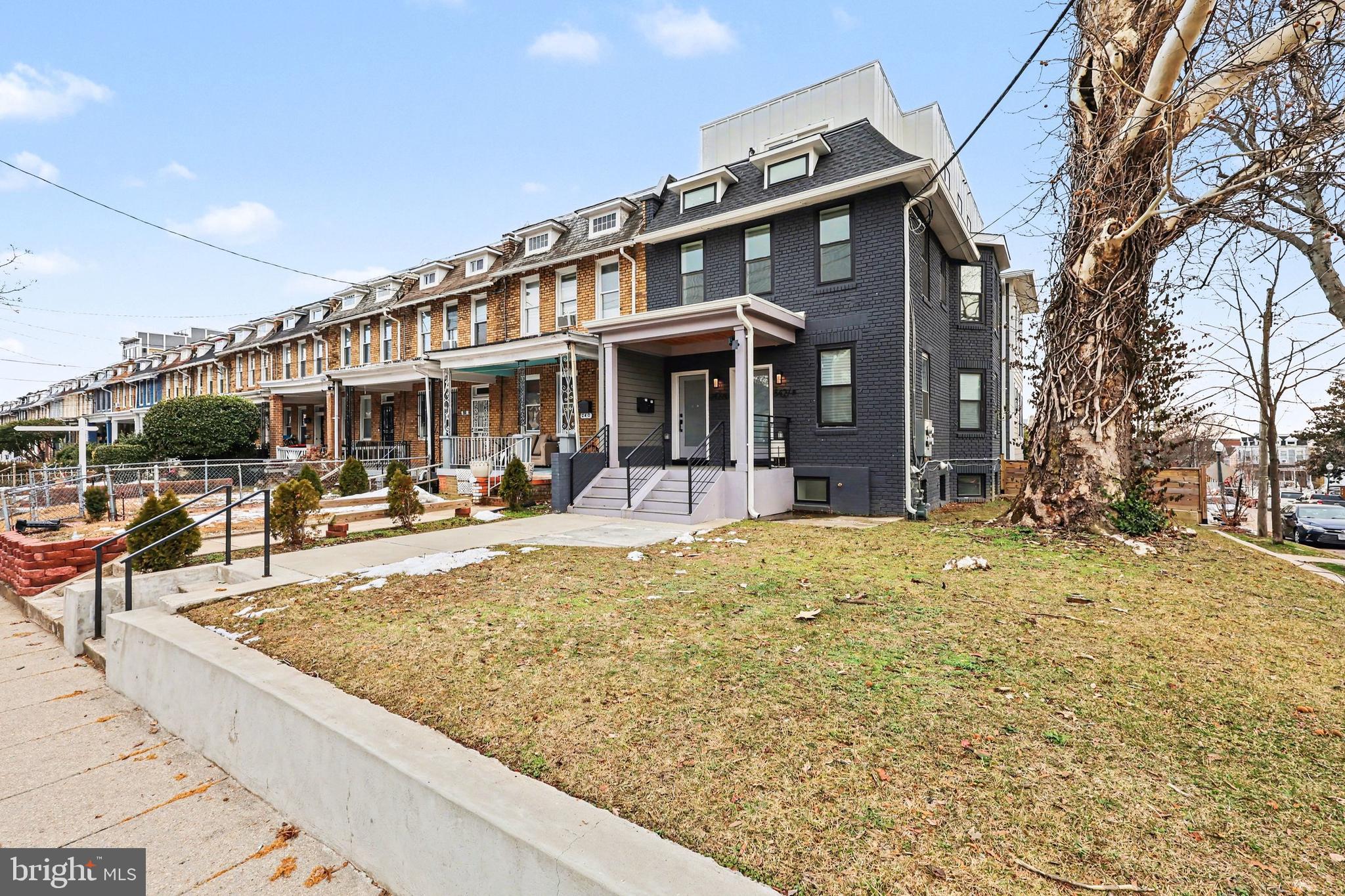 842 Madison Street Northwest, Unit 2 Washington, DC 20011 - Photo 24 of 27 a view of a building with a yard