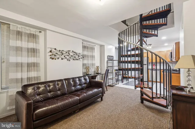 a kitchen with stainless steel appliances granite countertop a refrigerator a stove top oven a sink and dishwasher