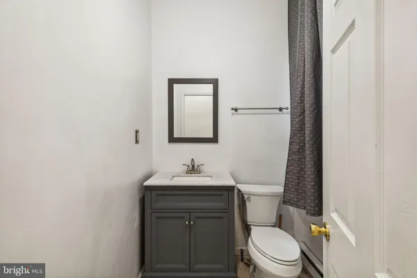 a bedroom with bed and cupboard