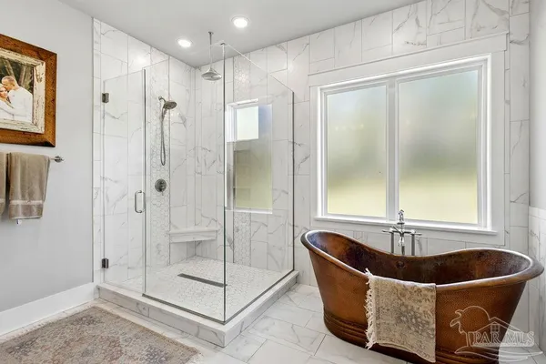 a bathroom with a granite countertop toilet a sink and a mirror