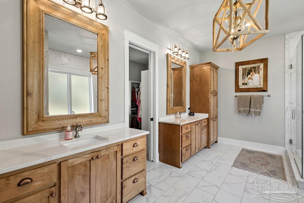 7520 Hidden Forest Trail Pace, FL 32571 - Photo 26 of 65 a spacious bathroom with a double vanity sink mirror and