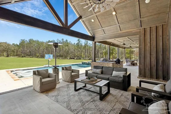 a view of a swimming pool and a yard