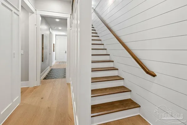 a view of a workspace with furniture and a flat screen tv