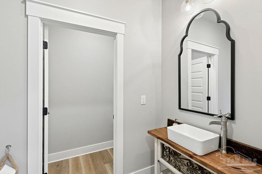 7520 Hidden Forest Trail Pace, FL 32571 - Photo 44 of 65 a bathroom with a sink and a mirror
