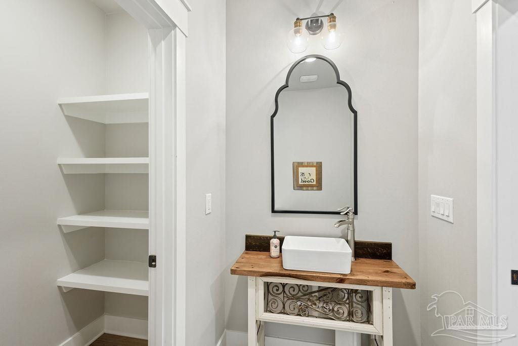 7520 Hidden Forest Trail Pace, FL 32571 - Photo 45 of 65 a room with a door and a mirror