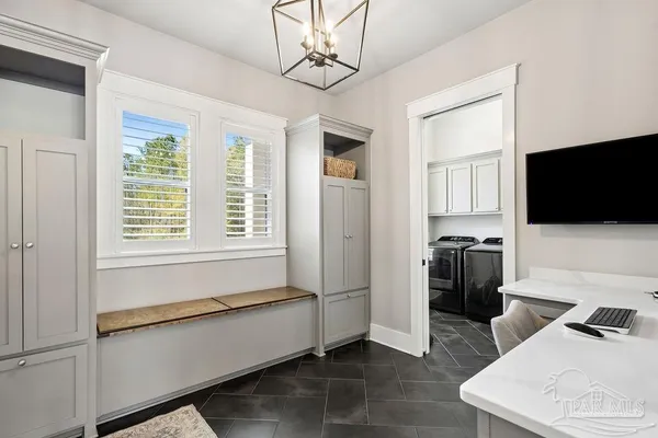 a aerial view of a house with swimming pool yard and outdoor seating