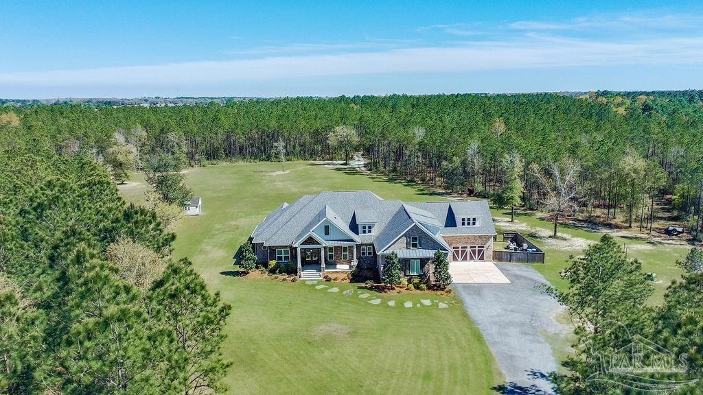 7520 Hidden Forest Trail Pace, FL 32571 - Photo 65 of 65 a front view of a house with a big yard