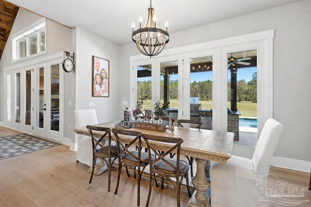 7520 Hidden Forest Trail Pace, FL 32571 - Photo 7 of 65 a view of a dining room with furniture window and wooden floor
