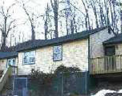 11 Portland Hill Road Redding, CT 06896 - Photo 1 of 1 a front view of a house with a yard