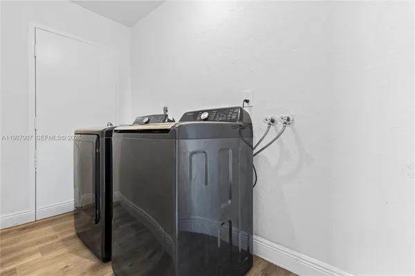 a view of storage and utility room with washer and dryer