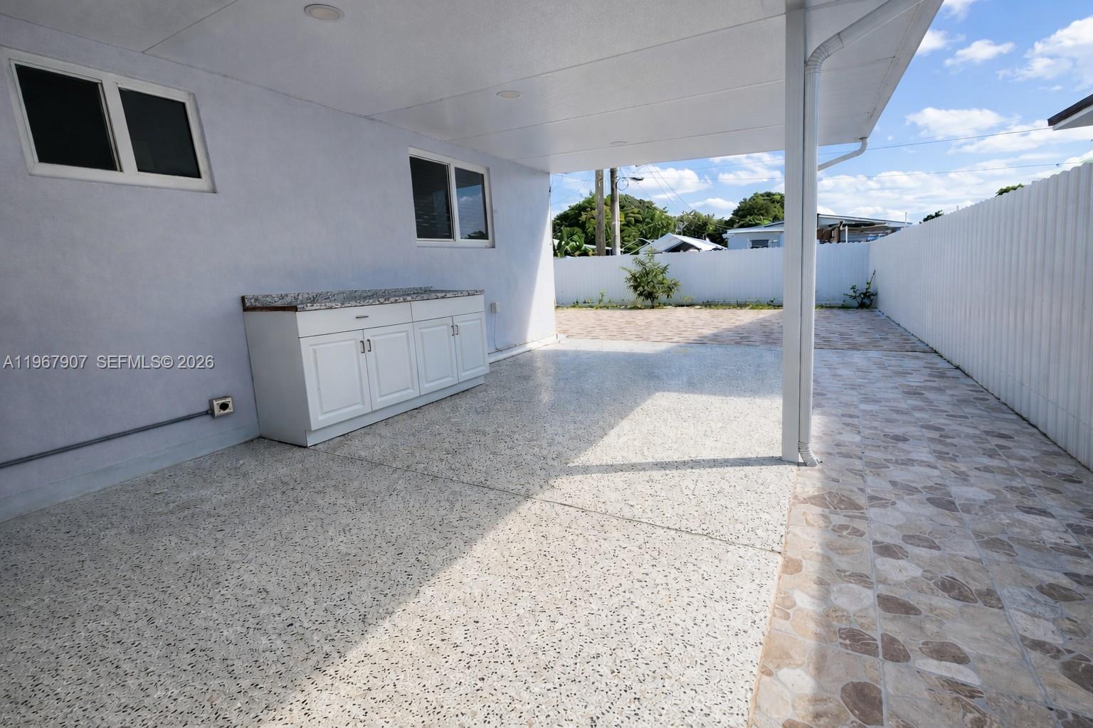 10360 Southwest 24th Street Miami, FL 33165 - Photo 12 of 14 a view of a house with a yard