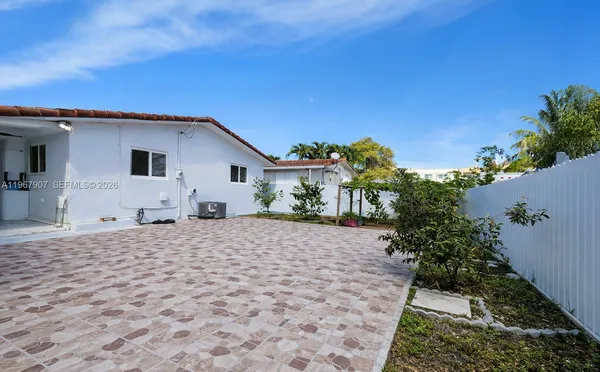 a house with trees in the background
