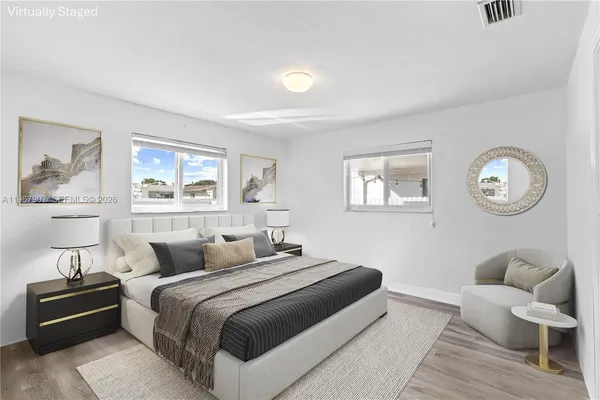 a bedroom with a bed and a couch