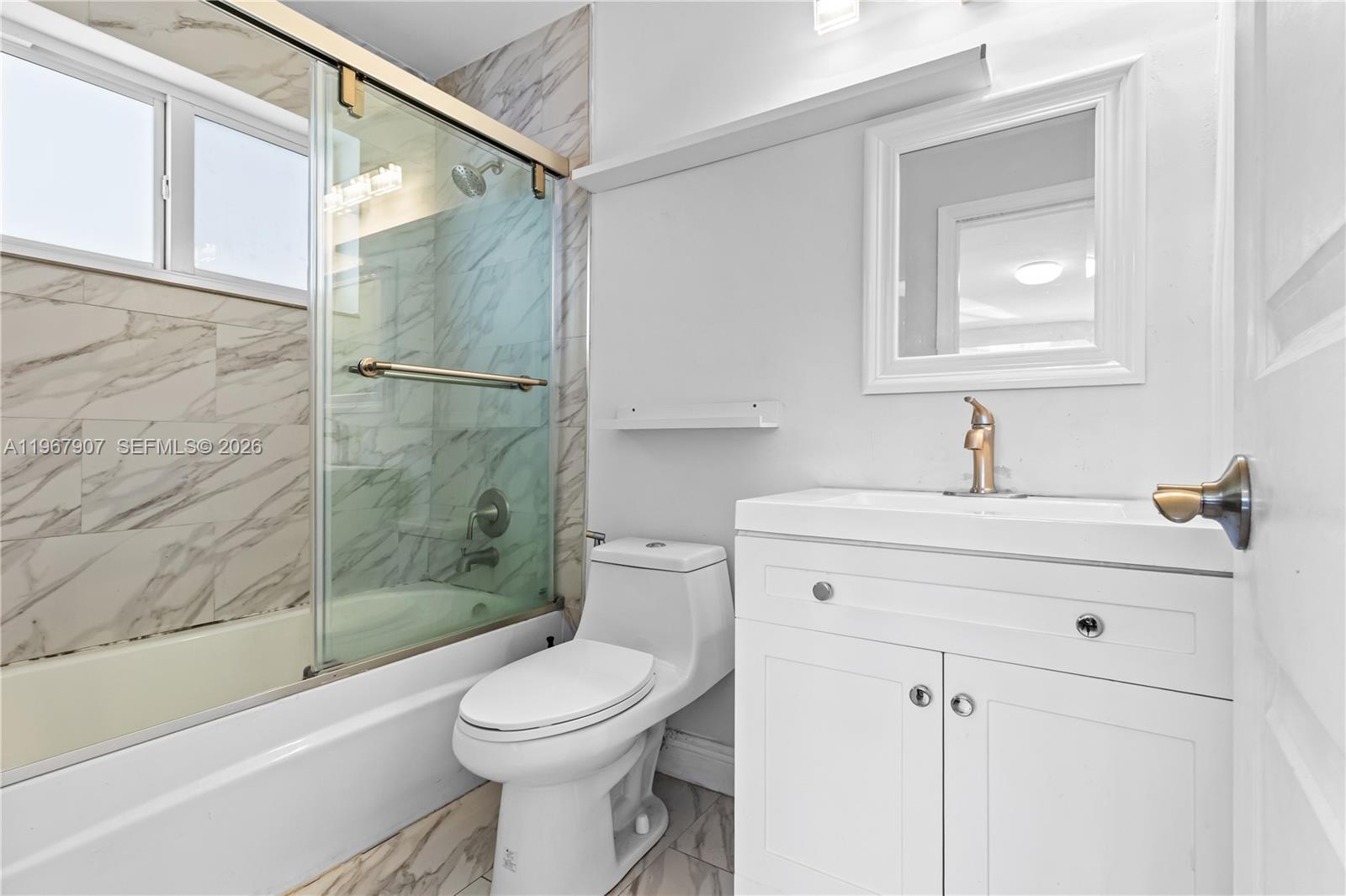 10360 Southwest 24th Street Miami, FL 33165 - Photo 8 of 14 a bathroom with a sink a toilet and shower