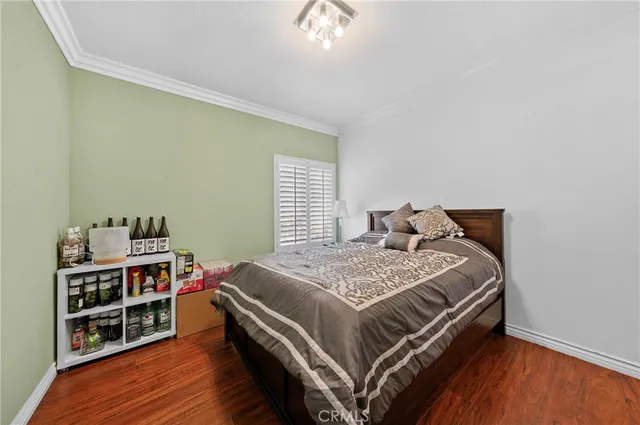 a bedroom with a bed and a book shelf