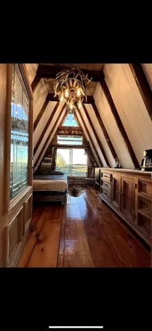 a view of entryway with a small yard