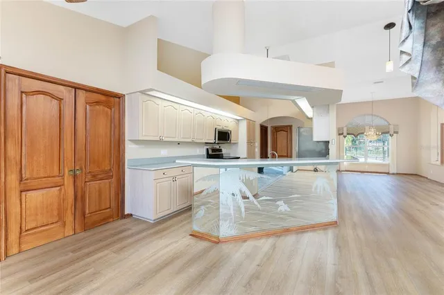 a bathroom with a tub sink and mirror