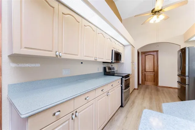 a bathroom with a sink mirror and a shower