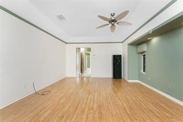 a view of an empty room with a window