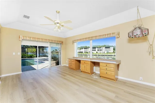 a view of swimming pool with seating space