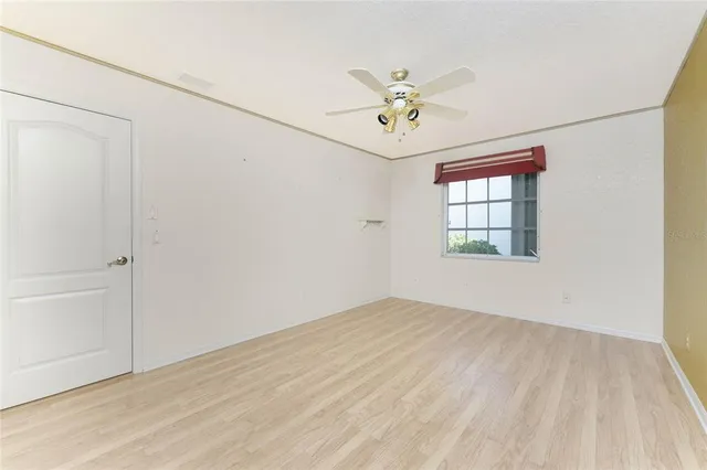 a view of empty room with a fireplace