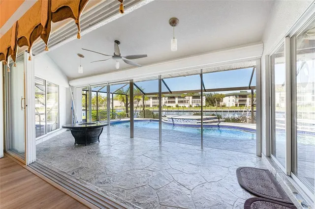 an aerial view of a houses with a yard