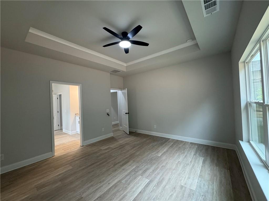 2057 North Hicks Road Toccoa, GA 30577 - Photo 14 of 23 wooden floor in an empty room with a window