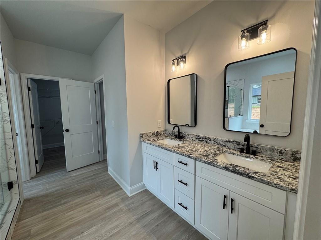 2057 North Hicks Road Toccoa, GA 30577 - Photo 15 of 23 a bathroom with a double vanity sink and mirror