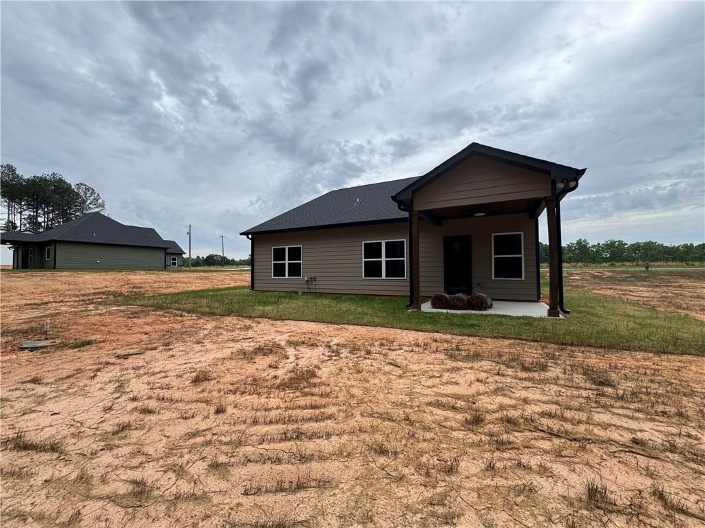 2057 North Hicks Road Toccoa, GA 30577 - Photo 22 of 23 a front view of a house with garden