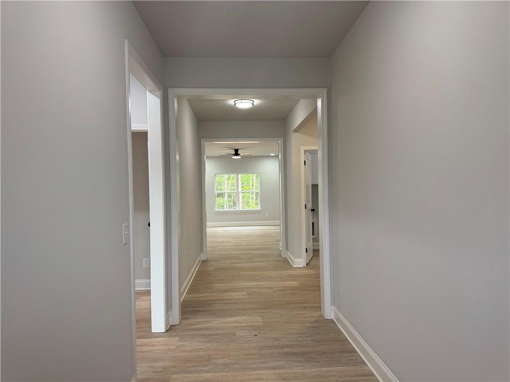 2057 North Hicks Road Toccoa, GA 30577 - Photo 3 of 23 a view of a hallway with wooden floor and staircase