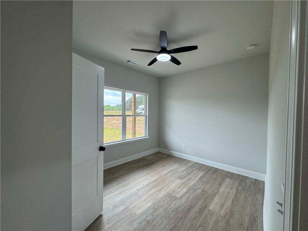 2057 North Hicks Road Toccoa, GA 30577 - Photo 6 of 23 a view of an empty room with a window