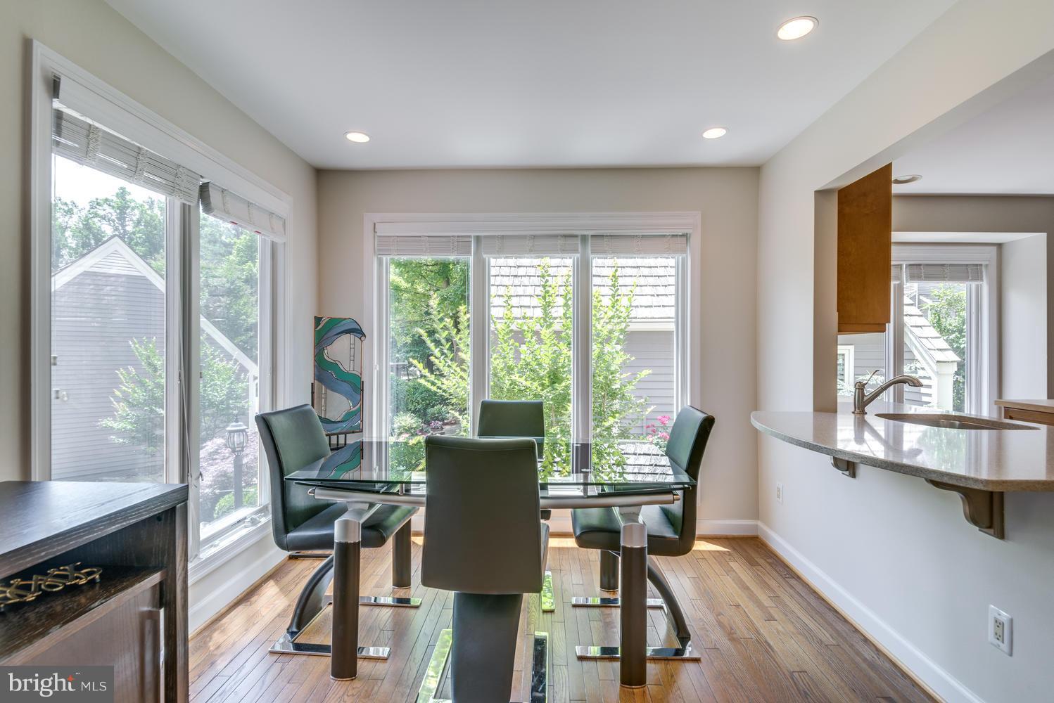 11616 Chapel Cross Way Reston, VA 20194 - Photo 14 of 30 a view of a dining room with furniture window and outside view