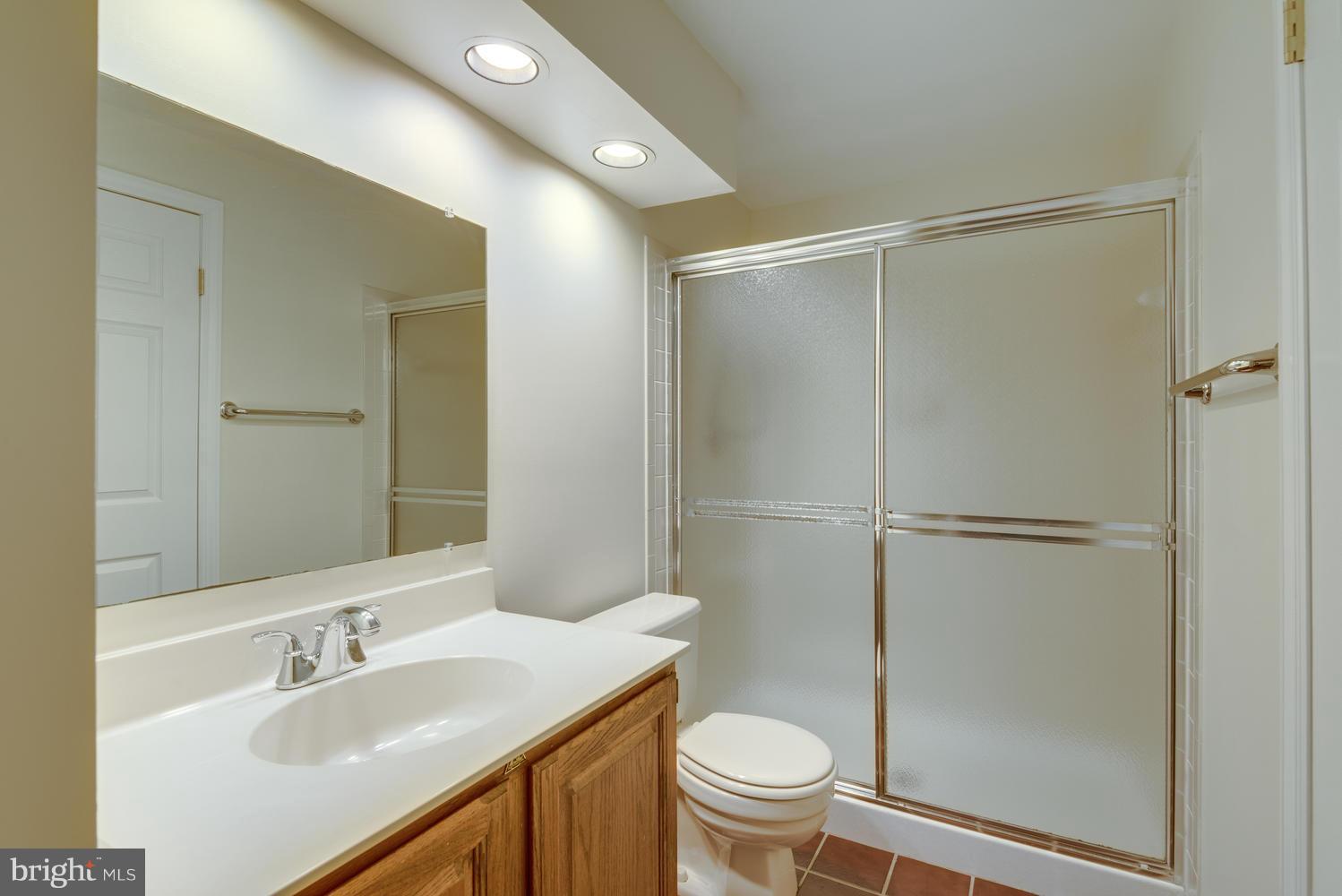 11616 Chapel Cross Way Reston, VA 20194 - Photo 22 of 30 a bathroom with a sink toilet and shower