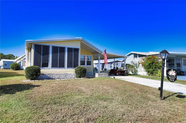 a view of a chairs and table in a patio