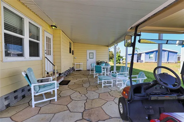 a backyard of a house with seating space