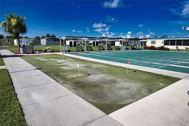 a view of a room with lots of residential buildings and wooden floor