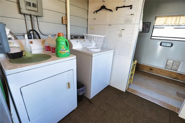 a utility room with dryer and washer