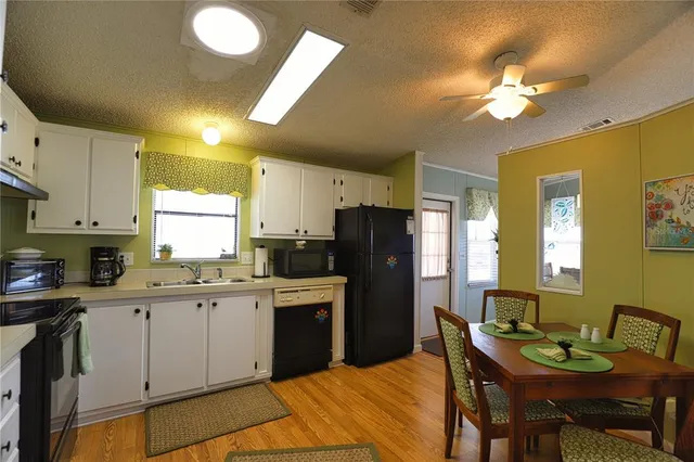 a dining room with furniture and a chandelier