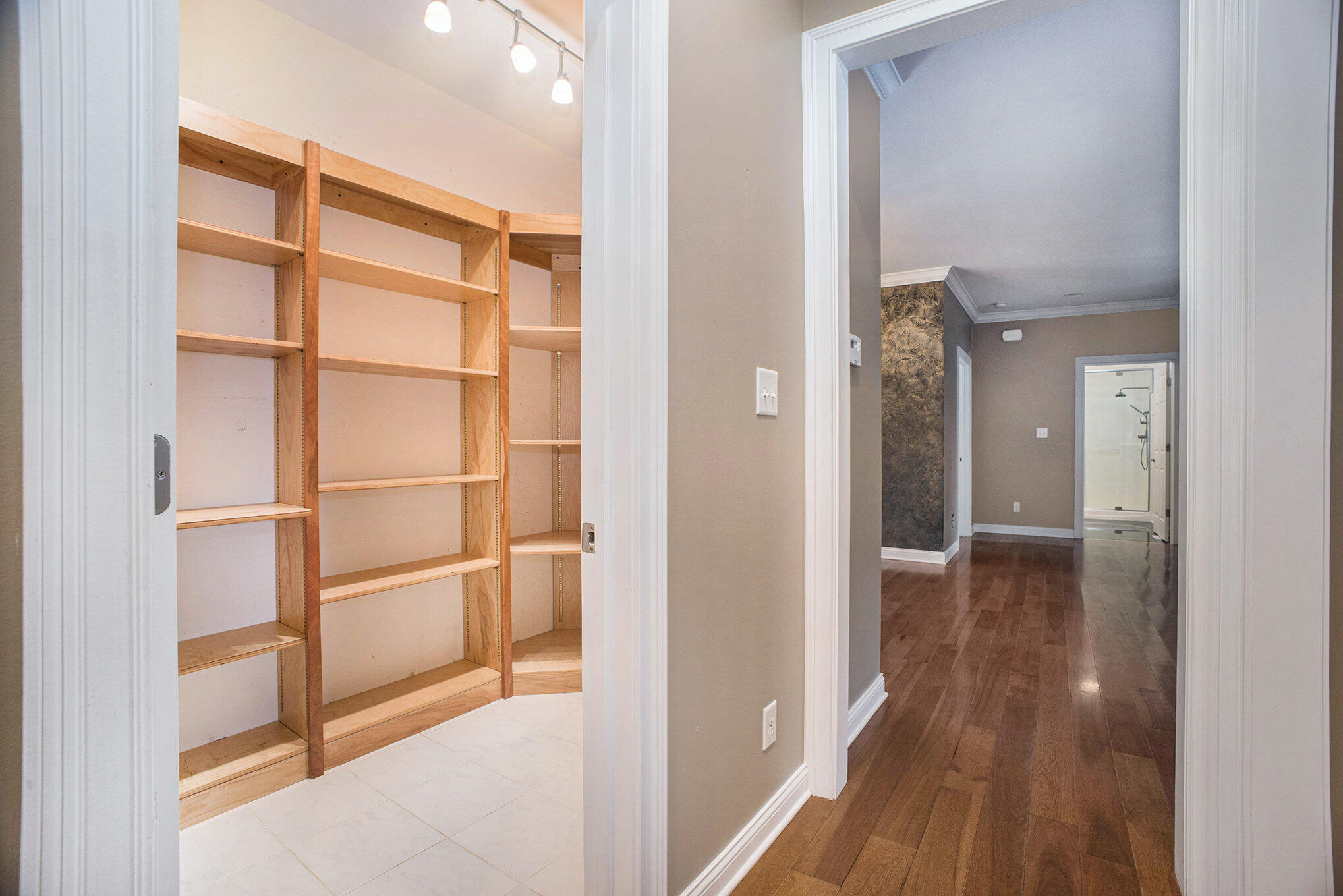 10198 California Street Crown Point, IN 46307 - Photo 15 of 41 a view of a hallway with wooden floor and closet