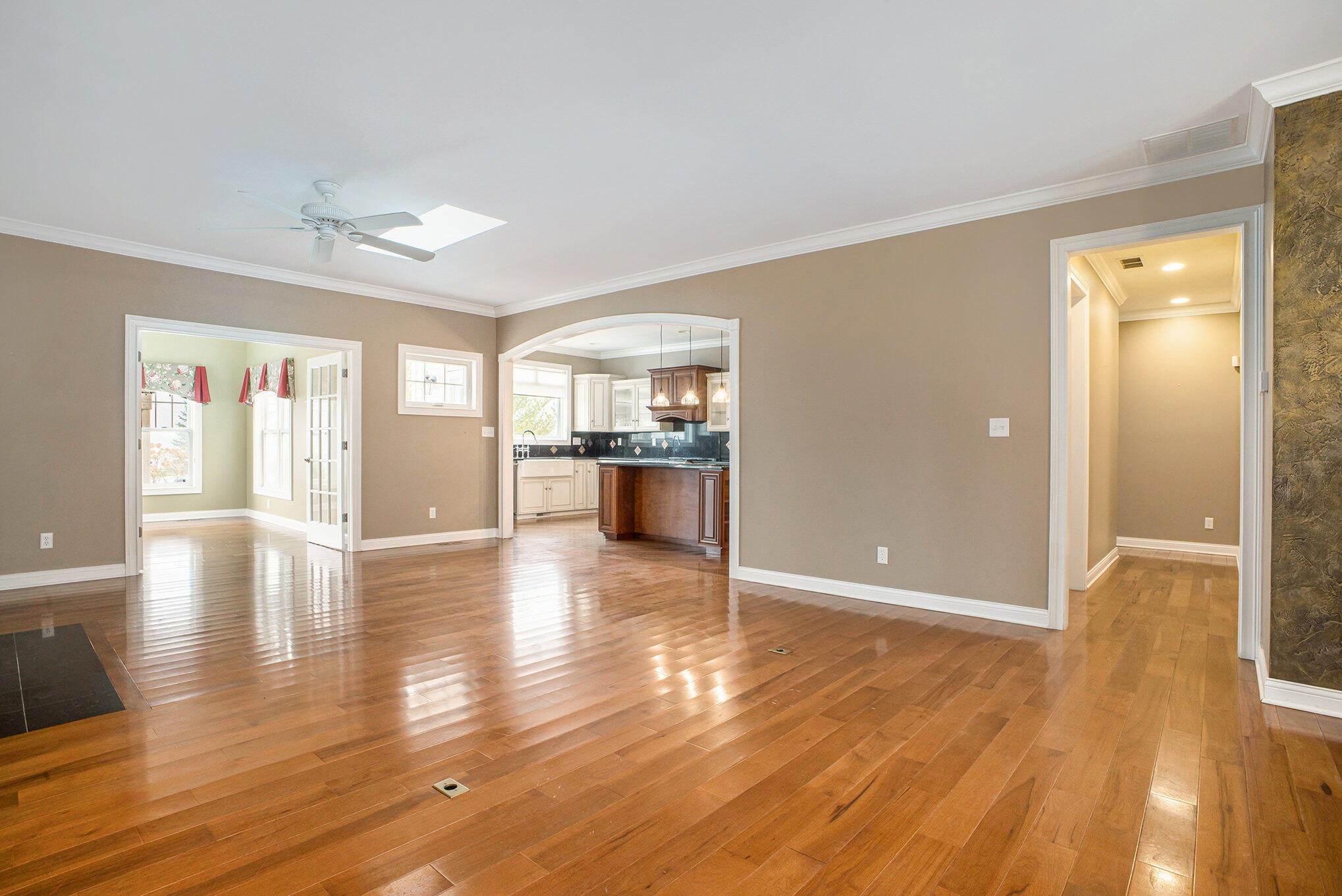 10198 California Street Crown Point, IN 46307 - Photo 5 of 41 an empty room with wooden floor and windows