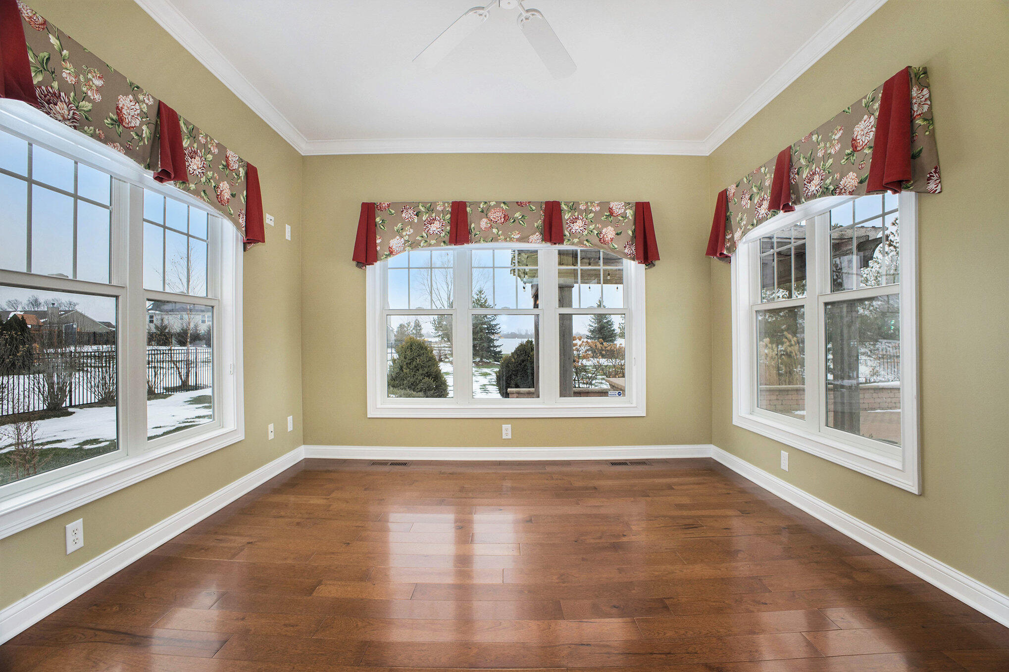 10198 California Street Crown Point, IN 46307 - Photo 6 of 41 a view of a big room with windows and entryway of the house
